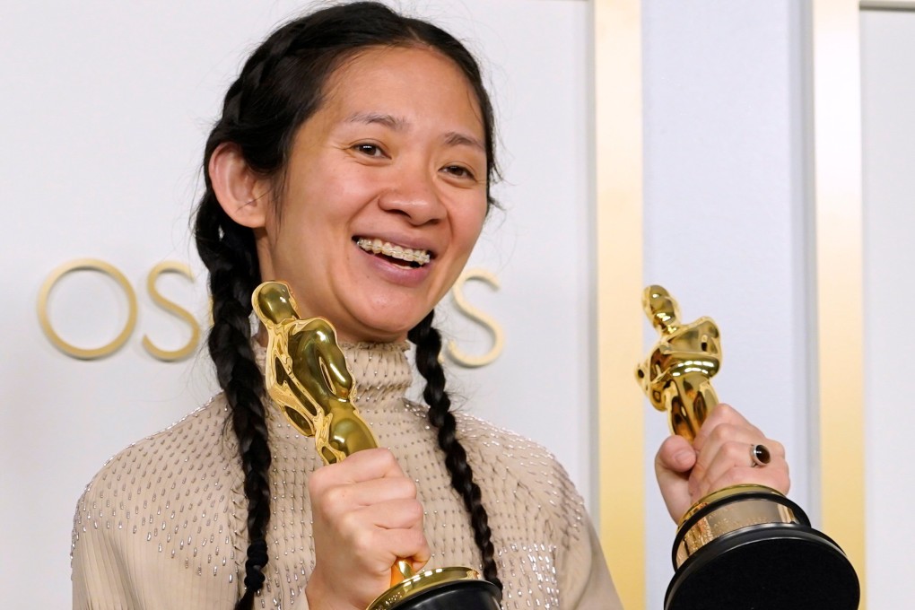 Chloé Zhao shows off her Oscars for best picture and director for Nomadland, but the news went unheralded in China. Photo: AP