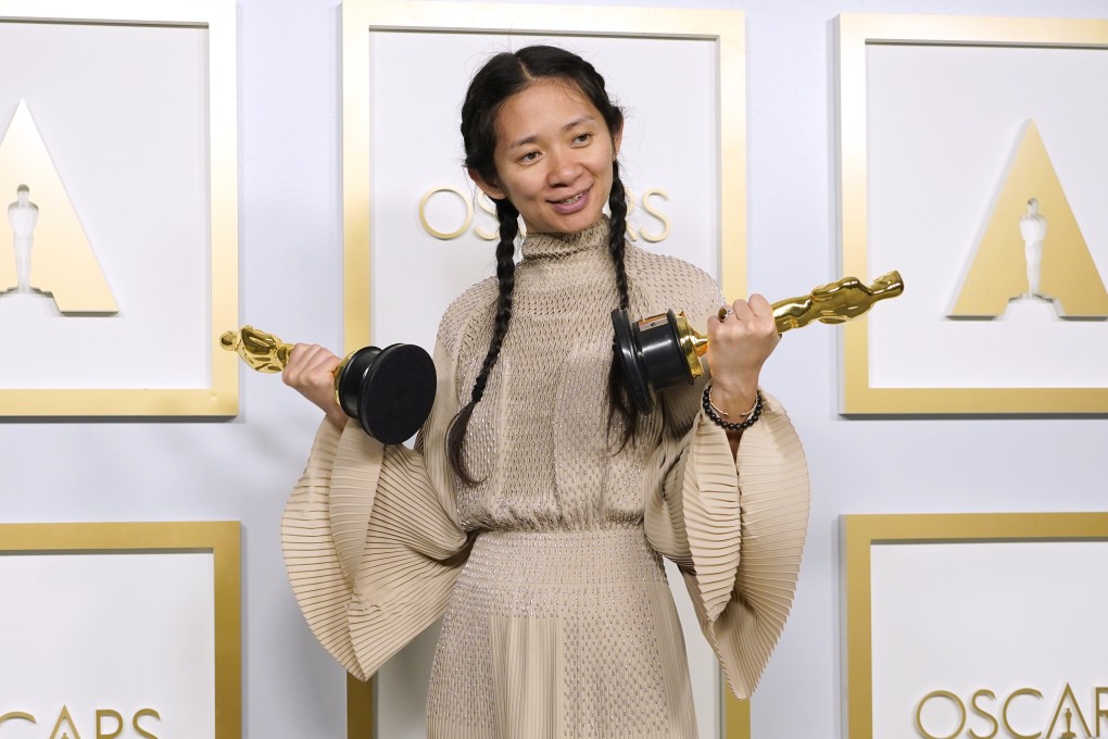 Chloé Zhao with her Oscars for best picture and director for Nomadland. Photo: AP
