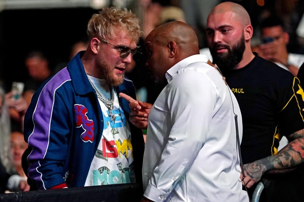 YouTube star Jake Paul is confronted by ringside announcer Daniel Cormier at UFC 261. Photo: Jasen Vinlove/USA TODAY Sports