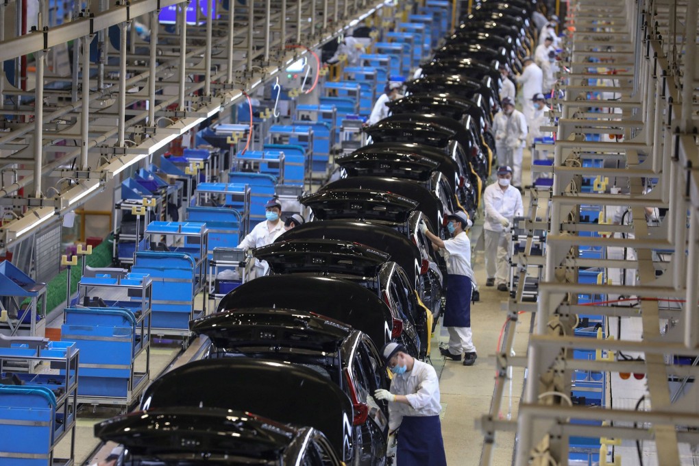 Employees on an assembly line at an auto plant of Dongfeng Honda in the Hubei provincial capital of Wuhan on April 15, 2021. Photo: AFP