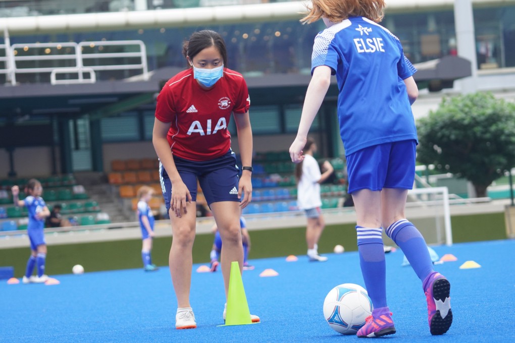 Allyson Shick coaching for the Hong Kong Football Club Junior Soccer programme. Coaches and parents say it is great to see their kids back engaged in sport. Photo: Winson Wong