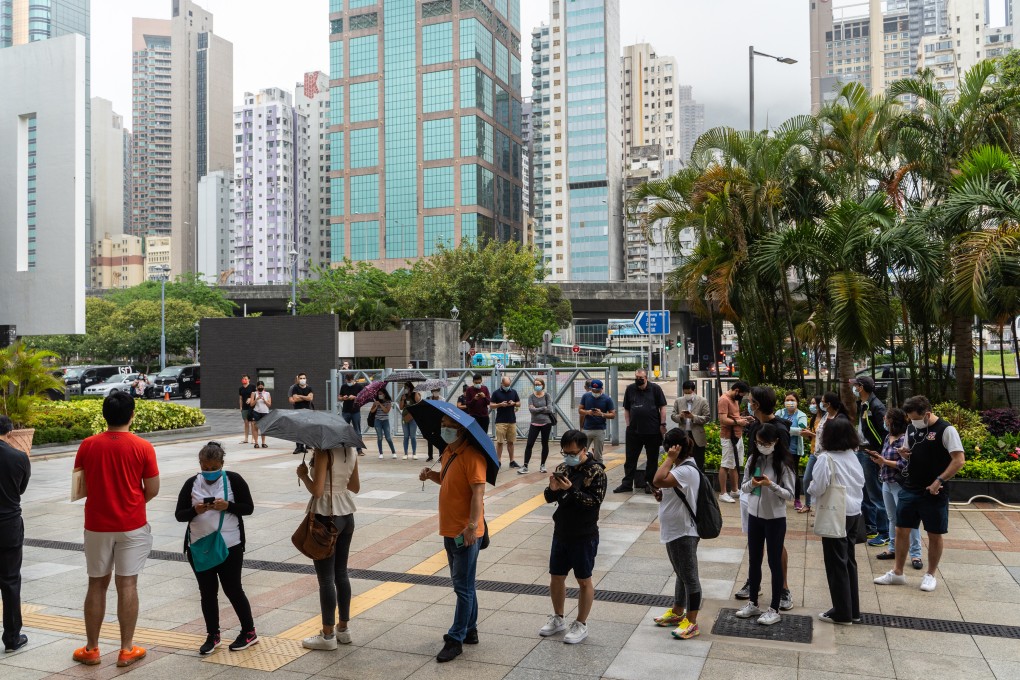 People stand in line outside a community vaccination centre administering the BioNTech Covid-19 vaccine in Hong Kong on April 5. Photo: Bloomberg