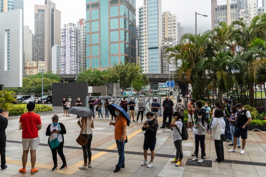 People stand in line outside a community vaccination centre administering the BioNTech Covid-19 vaccine in Hong Kong on April 5. Photo: Bloomberg