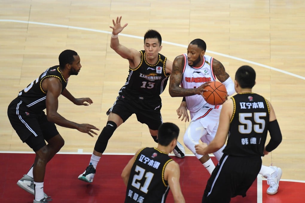 Sonny Weems, of the Guangdong Southern Tigers, dribbles through a crowd of Liaoning Flying Leopards players in game one of the 2020-21 Chinese Basketball Association finals. Photo: Xinhua