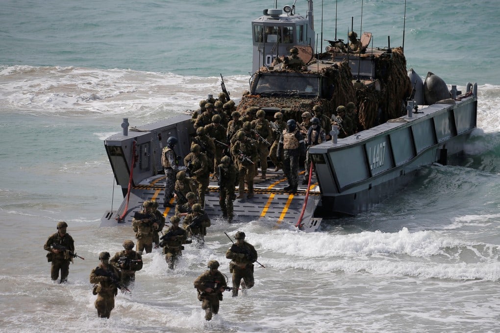 Australian soldiers practice an amphibious assault landing during joint military exercises between Australia and the United States in 2017. Photo: Reuters