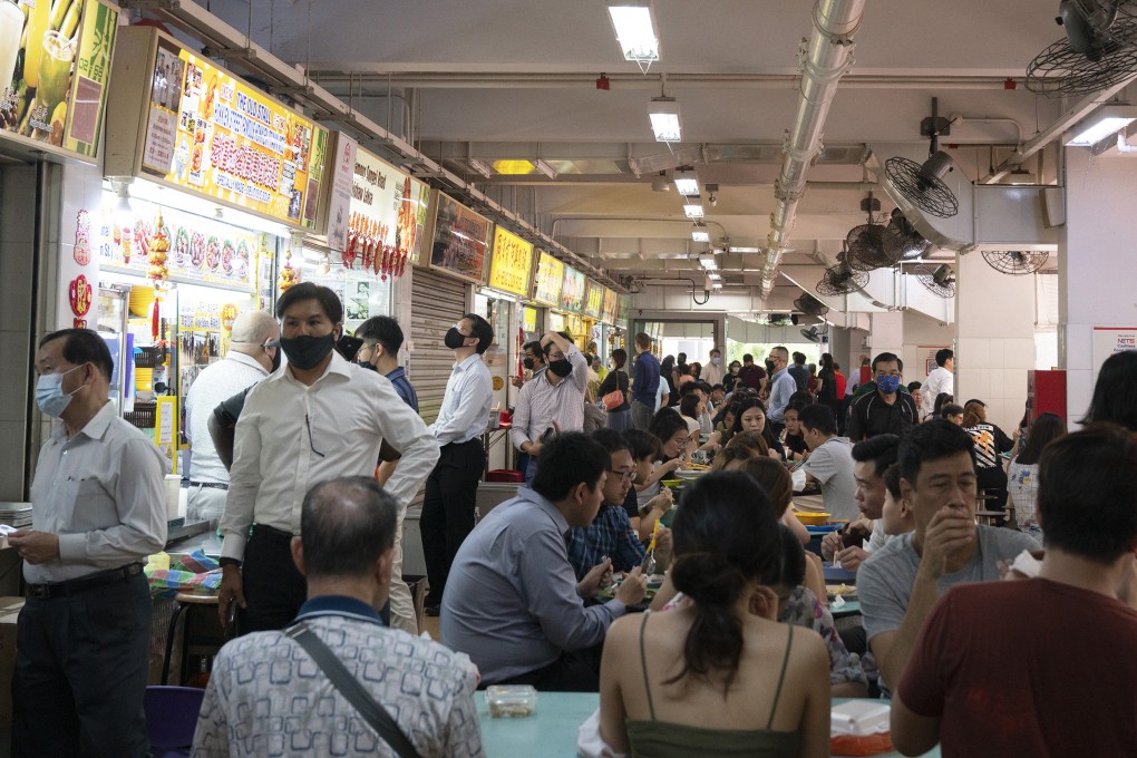 Customers eat at the Hong Lim Market and Food Centre in Singapore. Photo: Bloomberg