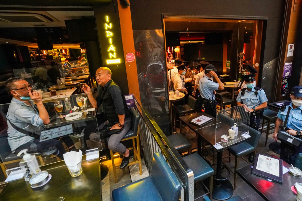 Police inspect arrangements at Lan Kwai Fong bars on Thursday. Photo: Felix Wong