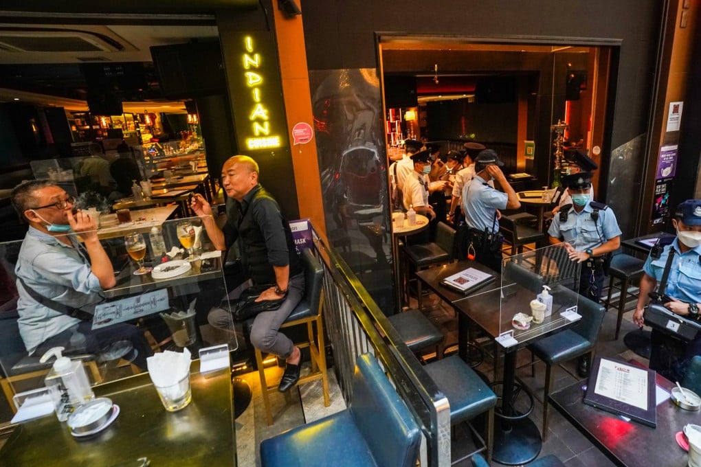 Police inspect arrangements at Lan Kwai Fong bars on Thursday. Photo: Felix Wong