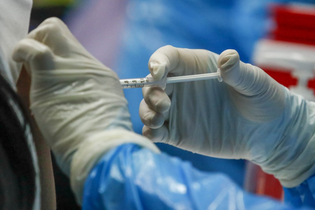 A patient receives their second dose of the Sinovac Covid-19 vaccine at a school in Bangkok, Thailand on Wednesday. Photo: EPA-EFE