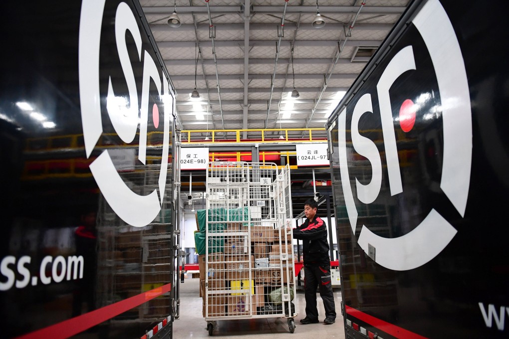 A worker moves parcels at an SF Express distribution centre ahead of the Singles Day online shopping festival, in Shenyang, Liaoning province in October 2018. Photo: Reuters