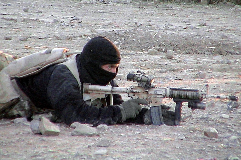 An undated photograph shows
a US Navy Seal during an operation in Afghanistan. Photo: AFP / Department of Defence