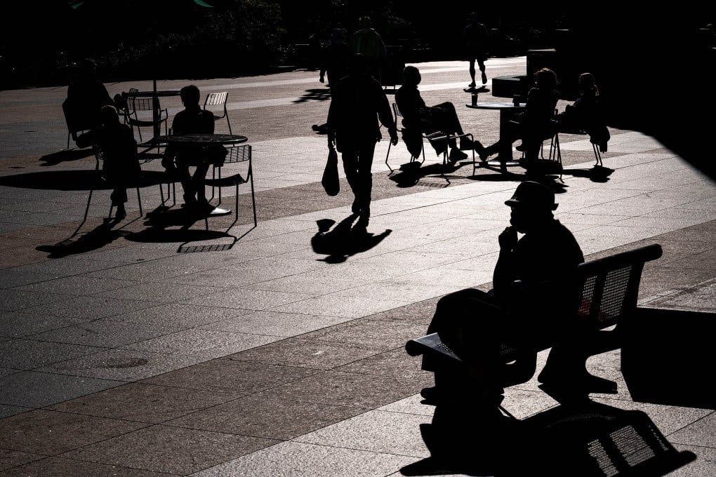 People sit in Union Square in San Francisco, California, US, on February 17. The Fed remains unlikely to raise interest rates until 2023. Photo: Bloomberg