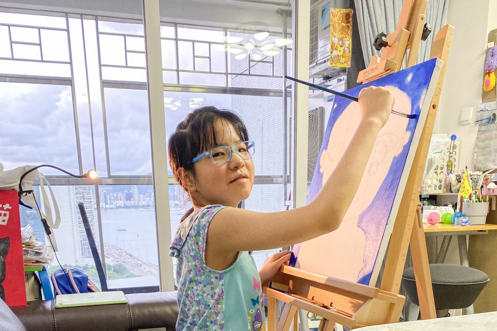 Sze Choi-lam works on her oil painting of a blue-blooded alien. Photo: Handout