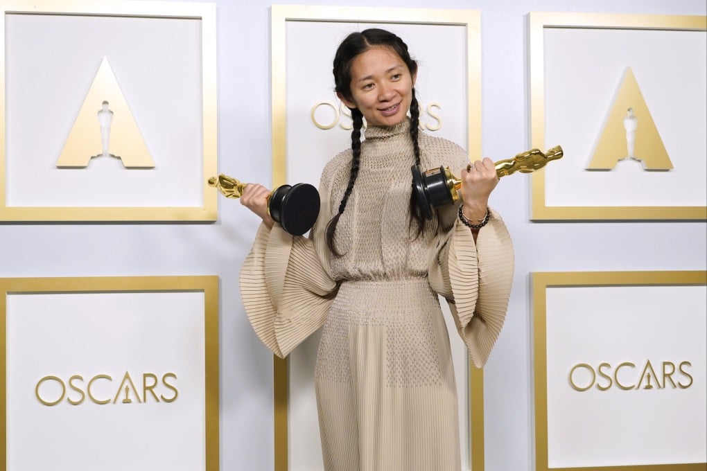 Chloe Zhao with her Academy Awards for best picture and best director for Nomadland. Photo: AP