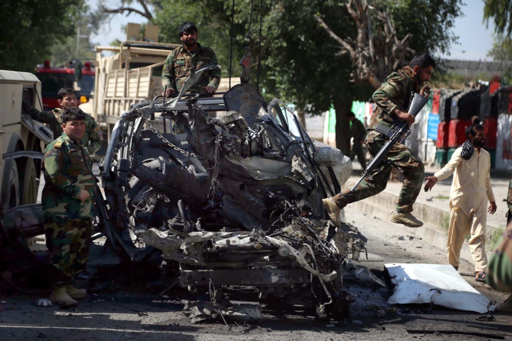 Afghan security forces inspect the scene of a bomb blast that targeted an army vehicle in Jalalabad, Afghanistan on Monday. Photo: EPA-EFE