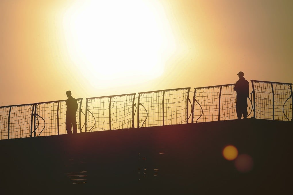 Members of the Indonesian navy stand on hospital ship KRI Dr. Soeharso as it prepares to join the search for submarine KRI Nanggala. Photo: AP