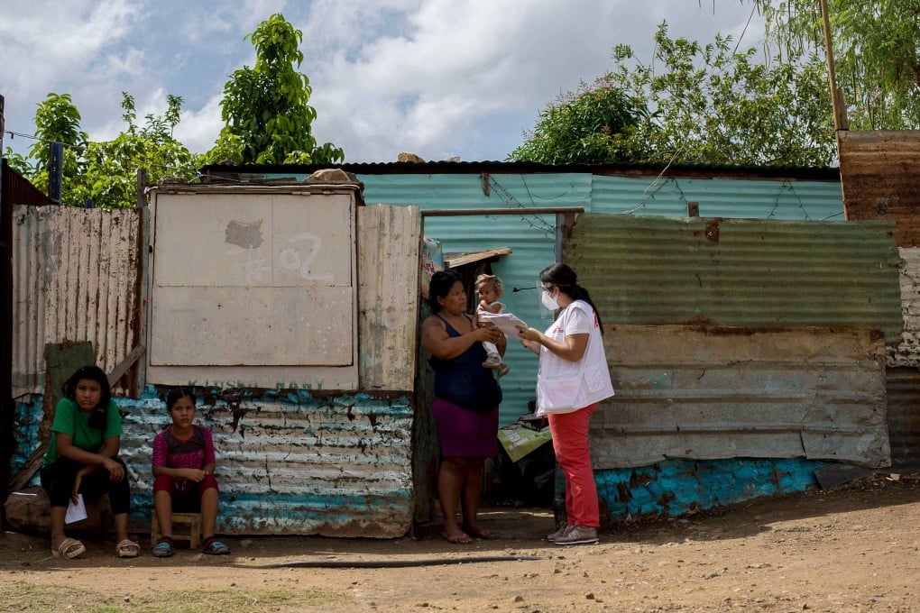 Medical volunteers from the Doctors Without Borders (MSF) organisation visit people during a vaccination day in Barcelona, Anzoategui state, Venezuela, on March 16. In Venezuela, there are people who have had malaria up to 20 times. Photo: AFP