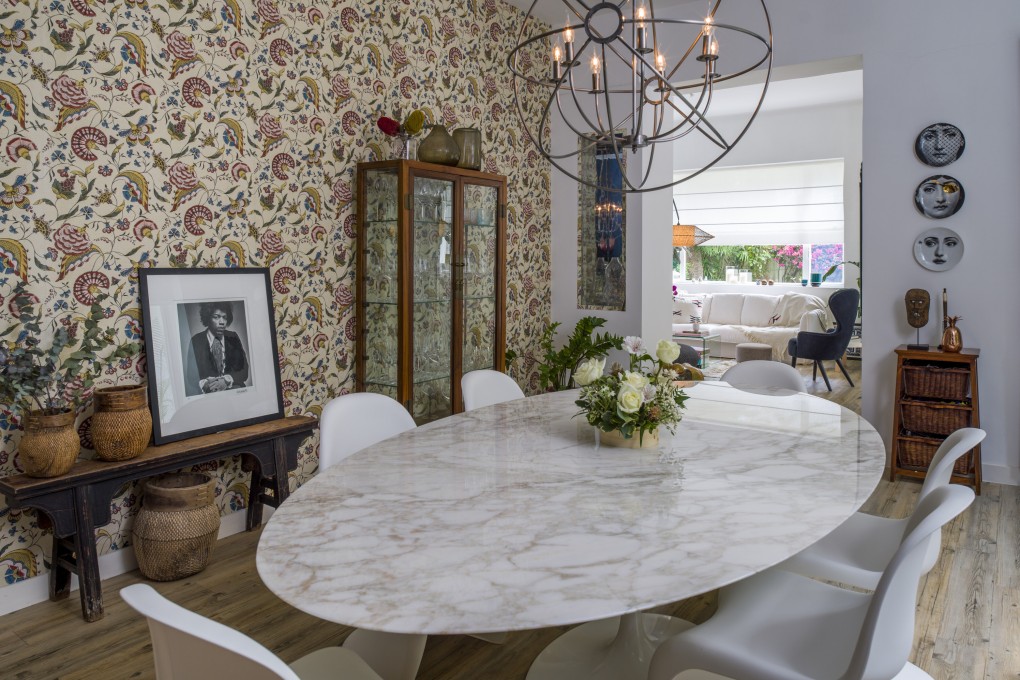 The decorative focal point of Fé Valvekens’ dining room in Stanley is its hand-painted wallpaper. Photo: John Butlin