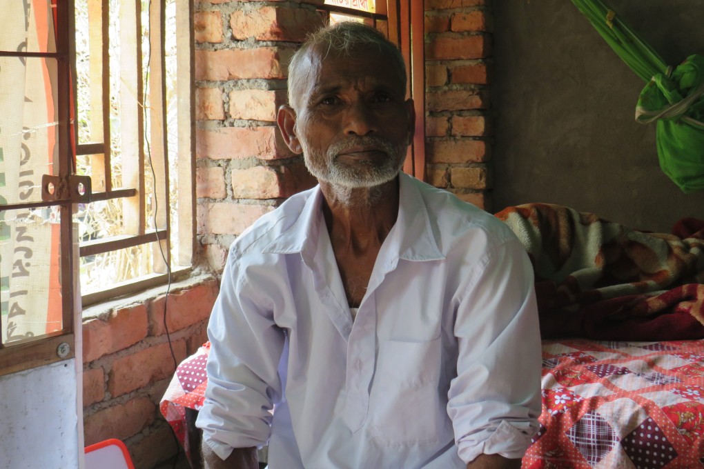 Gaur Hari Parua, a farmer at Ghoramara Island, pictured at his rebuilt house which had collapsed due to Cyclone Amphan. Photo: Namrata Acharya