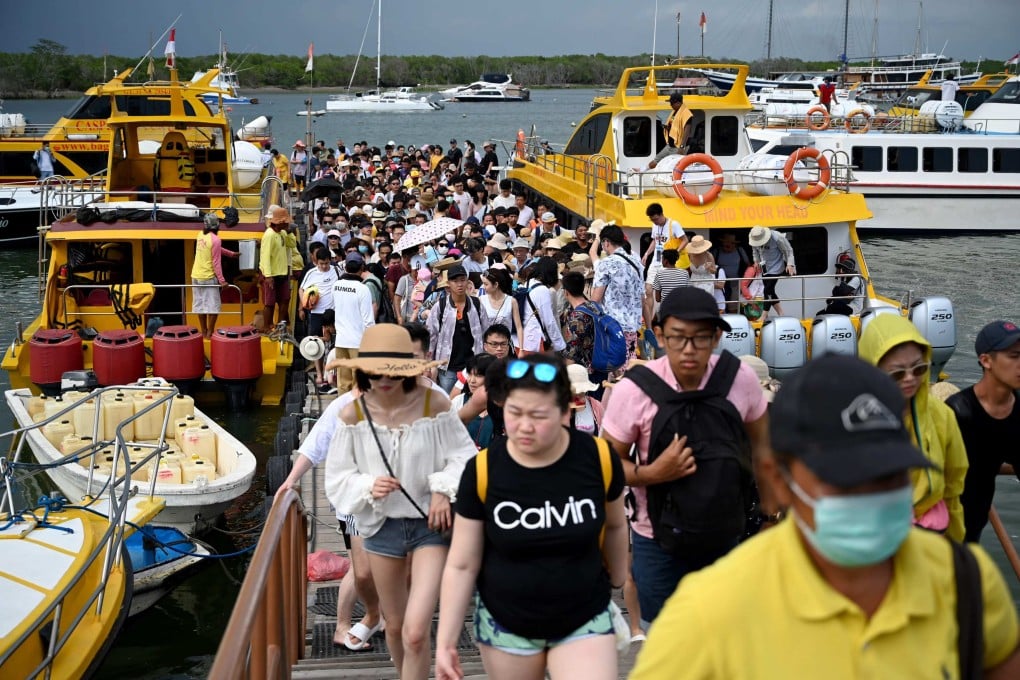 Chinese tourists arrive at a pier in Serangan island in Denpasar, on Indonesia’s resort island of Bali, on January 16, 2020. More than 2 million Chinese tourists visited Indonesia annually pre-pandemic, with about half headed to Bali. Photo: AFP