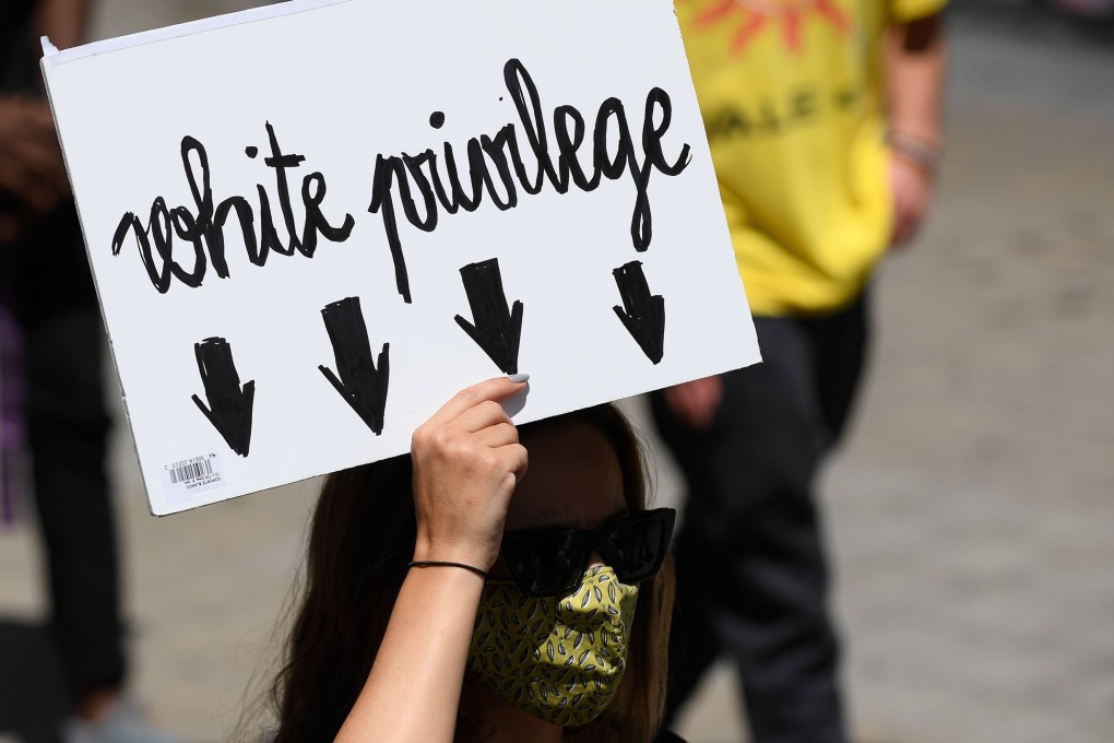 A woman at a protest following the killing in the United States of African-American man George Floyd. Photo: AFP
