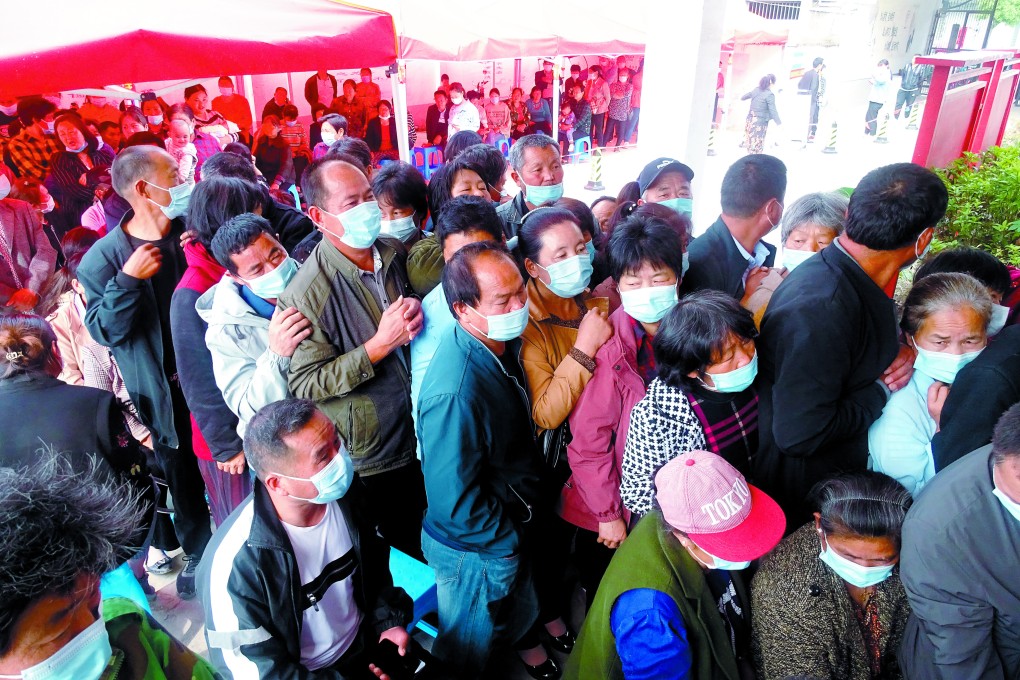 People line up for Covid-19 vaccinations in Linquan county, in eastern China’s Anhui province, on May 13. Picture: AP