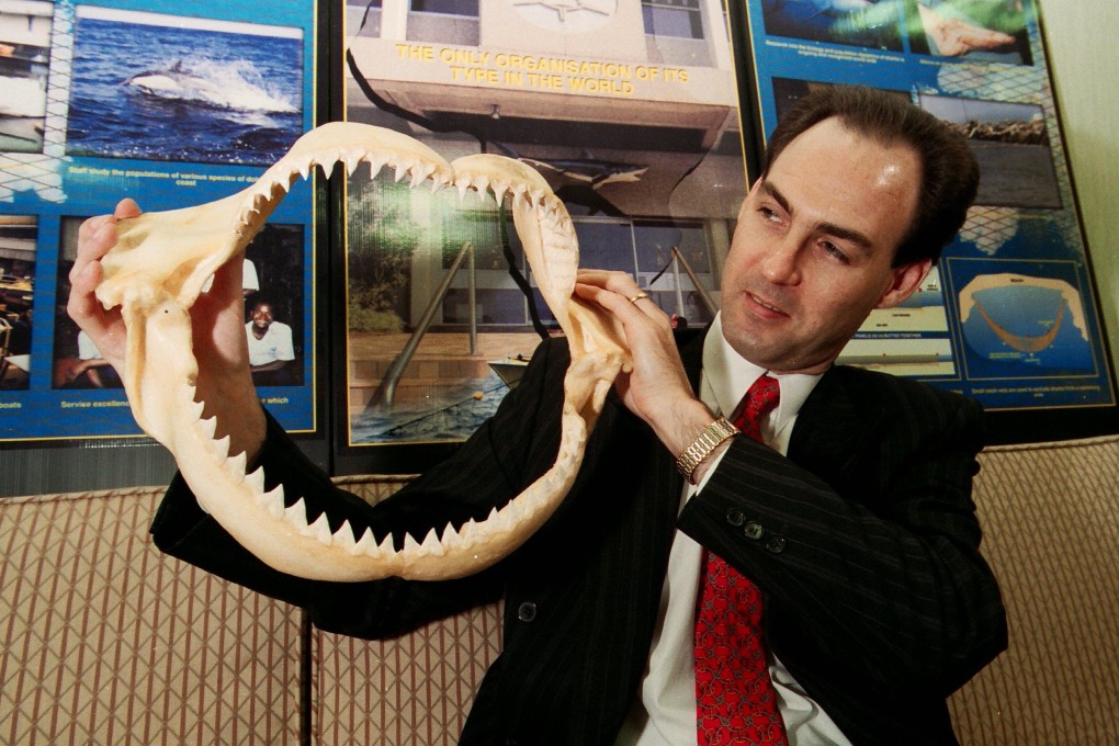 South African consul-general Michael Farr holding shark jaws at the centre of the Natal Sharks Board. The Board’s nets are used in Hong Kong to keep sharks away. Photo: CWH