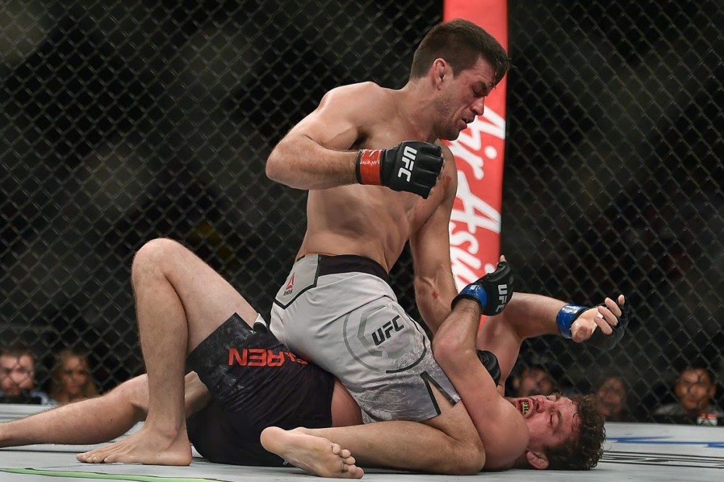 Demian Maia punches Ben Askren from the top. Photo: SingaporeMaven
