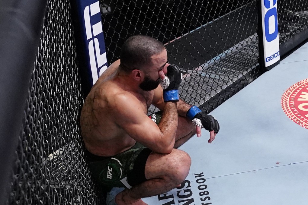 Bulal Muhammad feels his eye after referee Herb Dean calls off his fight against Leon Edwards after Muhammad was unable to continue due to an accidental eye poke. Photos: Jeff Bottari/Zuffa LLC via Getty Images
