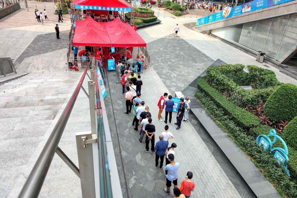 People queue to receive nucleic acid tests for Covid-19 in Shenzhen after an outbreak in the southern province of Guangdong. Photo: AFP