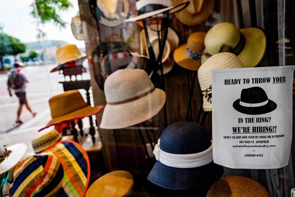 A hat store advertises that it is hiring in Annapolis, Maryland. Between stimulus cheques and expanded unemployment assistance, many workers are being paid at a rate of US$35,000 annually not to work. Photo: AFP