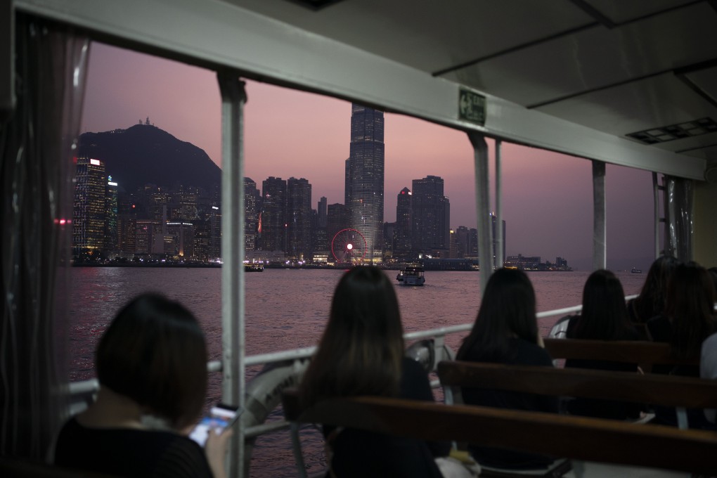 Passengers on a ferry cross the Victoria Harbour from Hong Kong Island to Kowloon as the sun sets in Hong Kong in October 2019. Photo:AP