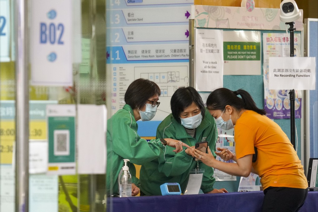 A person arrives for their BioNTech vaccination at Sun Yat Sen Memorial Park Sports Centre on Friday. Photo: Winson Wong