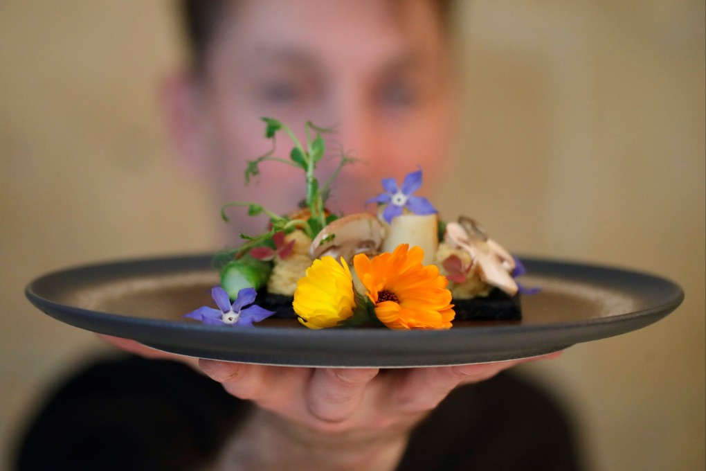 French chef Laurent Veyet displays a dish in his restaurant Inoveat, which serves insect-based food, in Paris, France, on May 12. Photo: Reuters