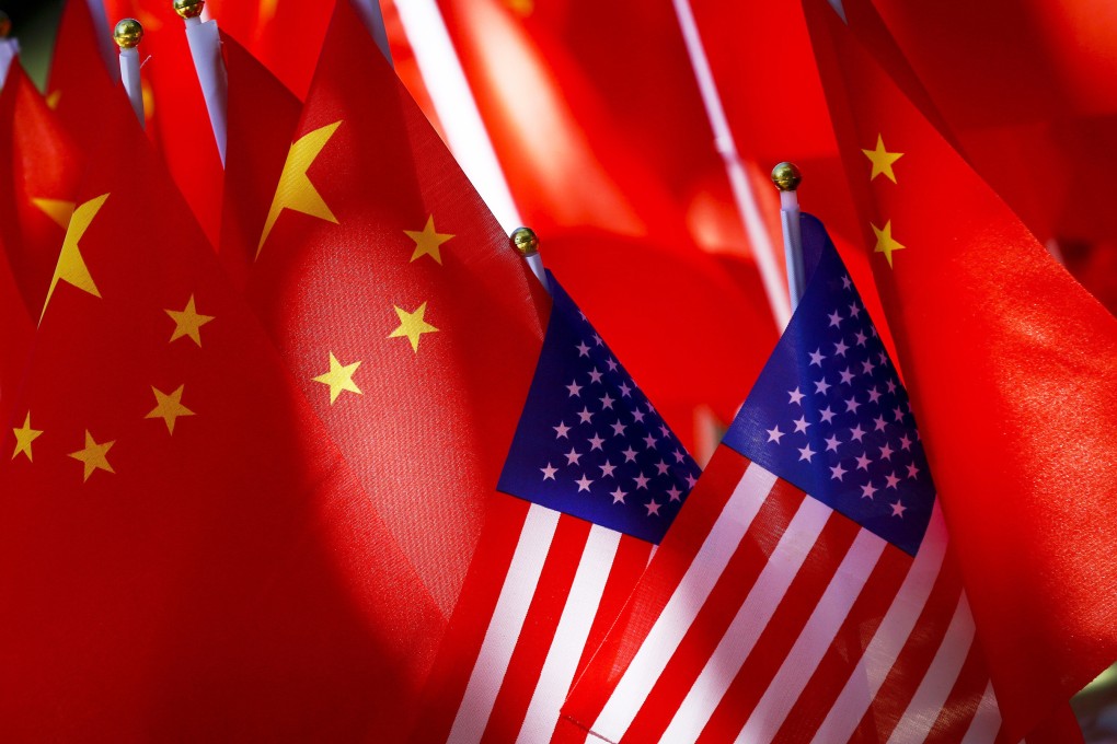 American flags are displayed together with Chinese flags on top of a vehicle in Beijing. Photo: AP