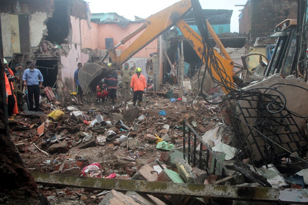 Firefighters carry out rescue operations after a building collapsed in Mumbai, India on Thursday after heavy rainfall. Photo: EPA-EFE