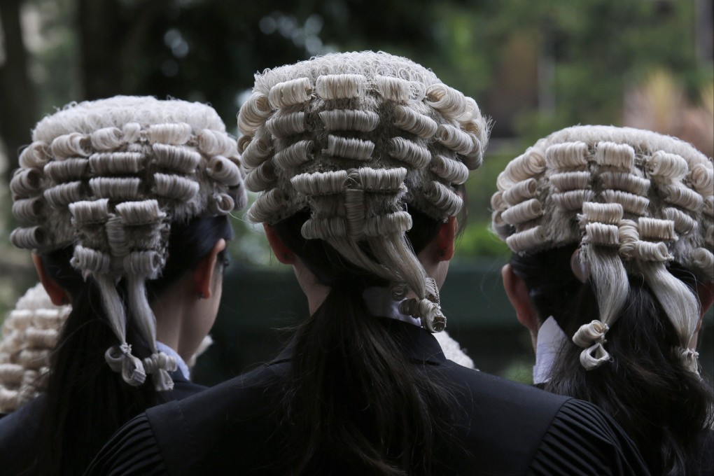 Barristers pose for a group photo after an appointment ceremony for senior counsel outside the Court of Final Appeal in June 2019. Photo: AP