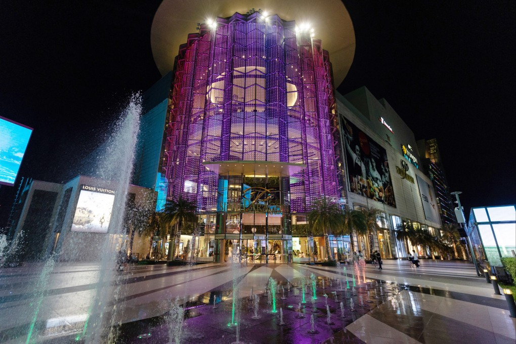 The Siam Paragon shopping mall in Bangkok, Thailand, is mostly empty of customers on a May night. Photo: Bloomberg