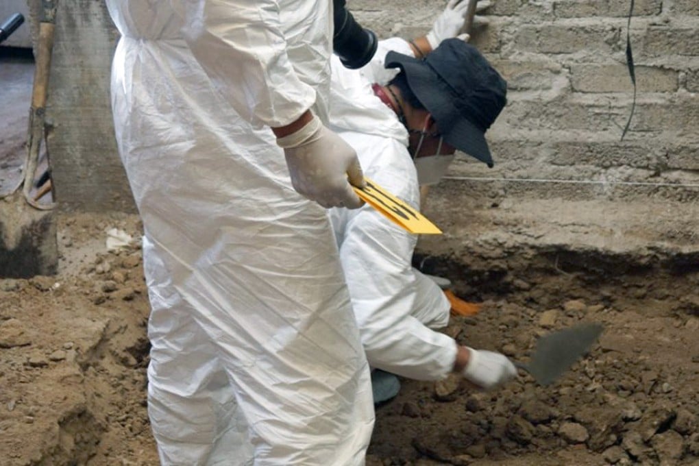A forensics team excavates at the house of alleged serial killer ‘Andres’ in Atizapan de Zaragoza, Mexico state. Photo: Mexico State Public Prosecutor’s Office / AFP