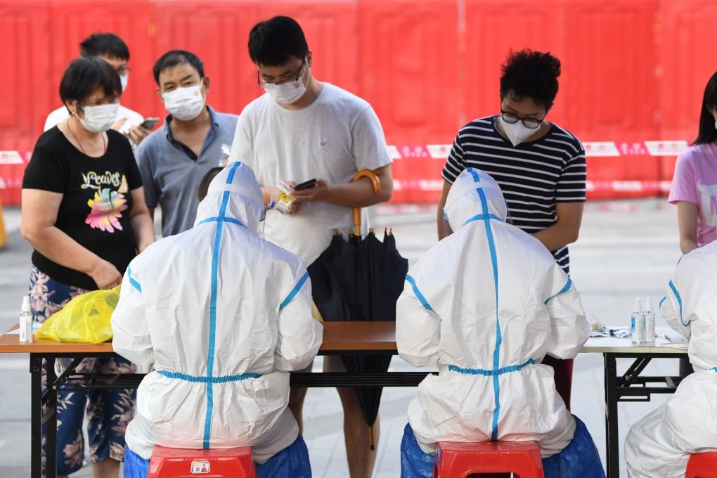 Residents from Guangzhou’s Liwan district register for Covid-19 tests as the city tries to contain an outbreak. Photo: Xinhua
