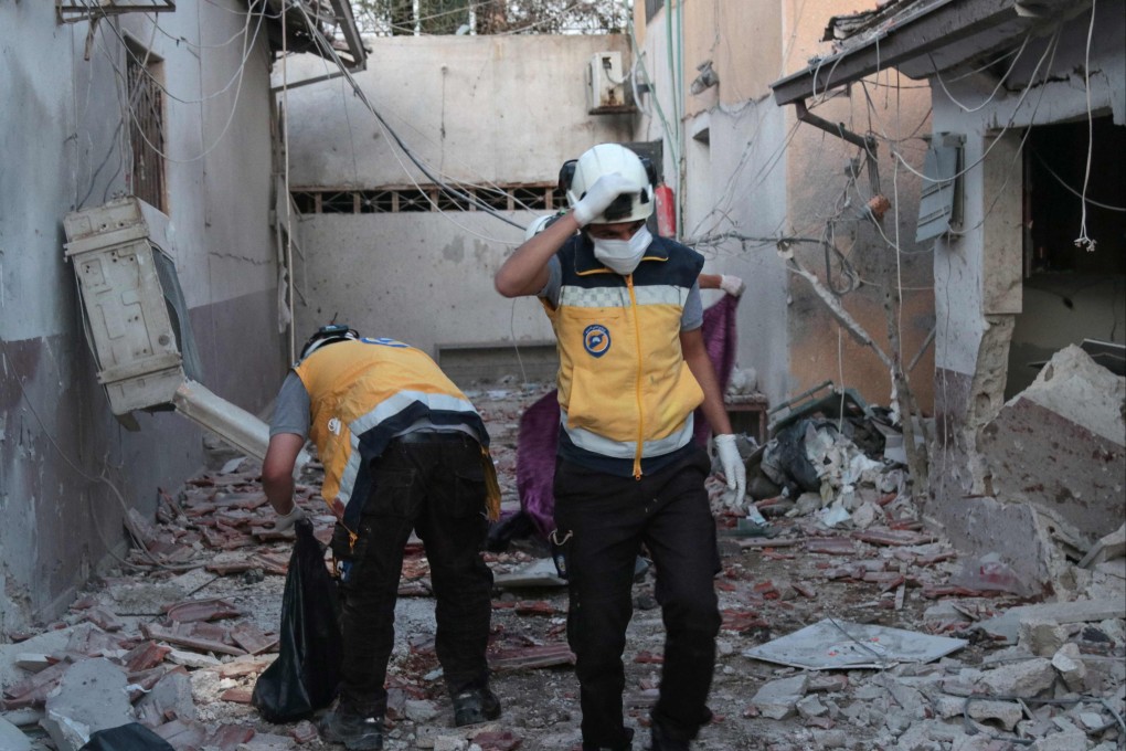 Members of Syria’s Civil Defence service (White Helmets) sift through the rubble at Al-Shifaa hospital in Afrin, northern Syria, on Saturday. Photo: AFP