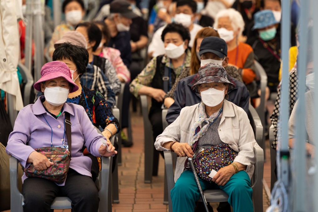 Elderly residents wait to receive a dose of the Pfizer-BioNTech vaccine in Seoul. Photo: Bloomberg