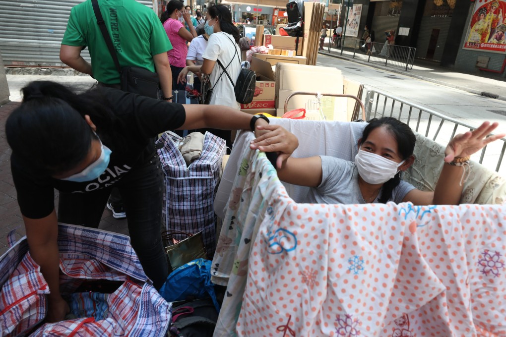 Foreign domestic workers in North Point pack daily items such as food, clothes and toys to ship back to their home country on May 16. Photo: Xiaomei Chen