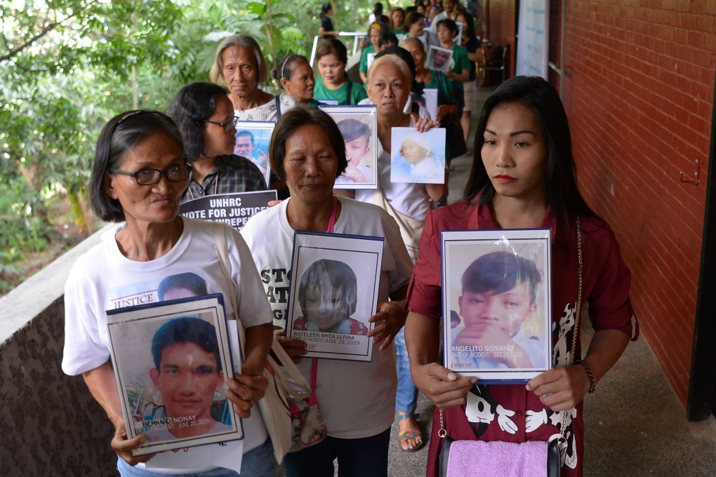 Relatives of victims of extrajudicial killings at a memorial mass at the Philippine Human Rights Commission office in Manila. Photo: AFP