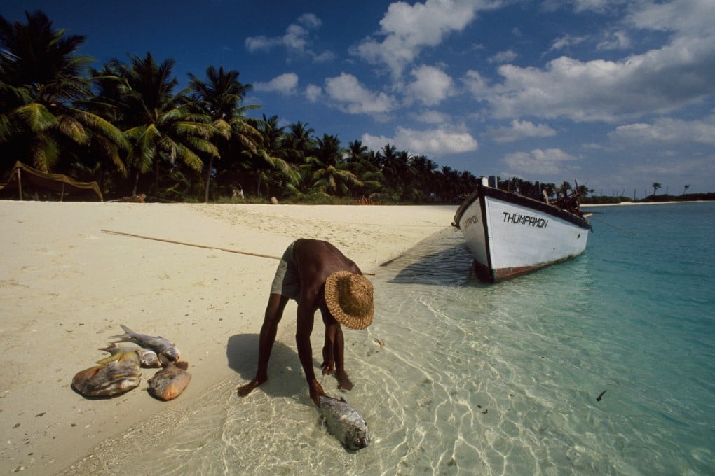 A fisherman brings in his catch on one of the islands in the Lakshadweep archipelago. Photo: AFP