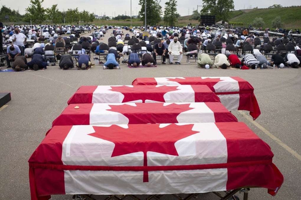 Mourners and supporters gather for a public funeral for members of the Afzaal family in London, Canada. Photo: AFP