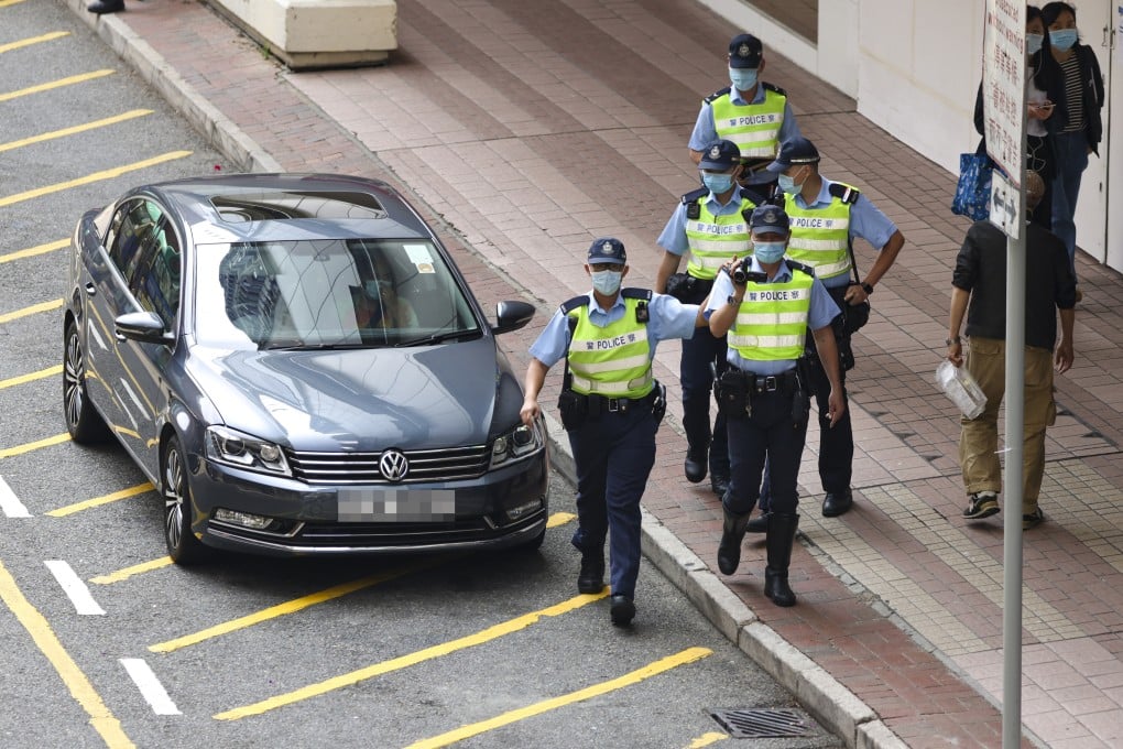 A Hong Kong police mobile video team near Shatin Plaza in Sha Tin on April 6 takes part in citywide operations to tackle traffic congestion-related offences at illegal parking black spots. Photo: Nora Tam
