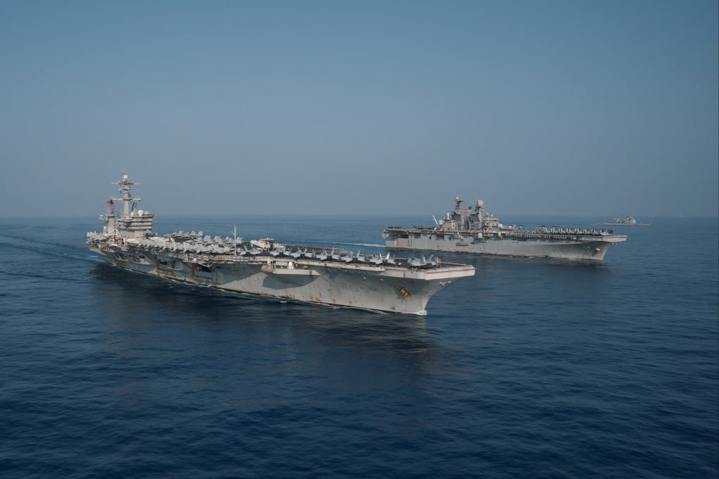 The Theodore Roosevelt Carrier Strike Group transits in formation with the Makin Island Amphibious Ready Group in the South China Sea in April. Photo: Handout