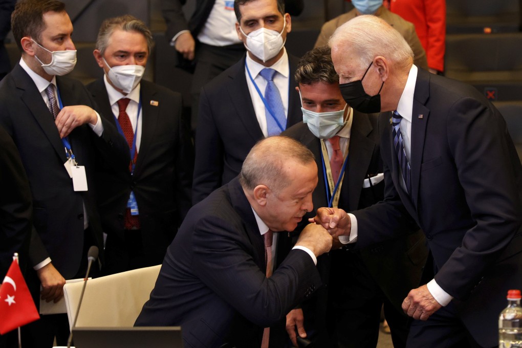 US President Joe Biden (right) is greeted by Turkey’s President Recep Tayyip Erdogan (centre) during a plenary session at the Nato summit in Brussels. Photo: AP