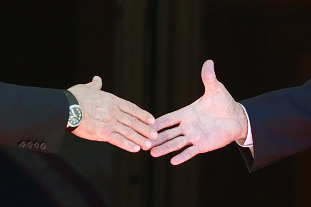 Russian President Vladimir Putin and US President Joe Biden shake hands before their summit in Geneva this week. Photo: AP